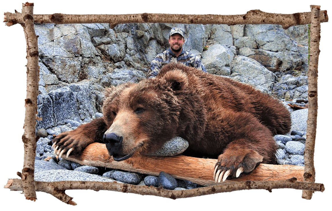 Hunter posing with bear.