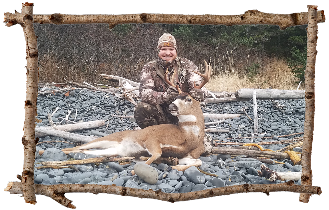 hunter holding a buck