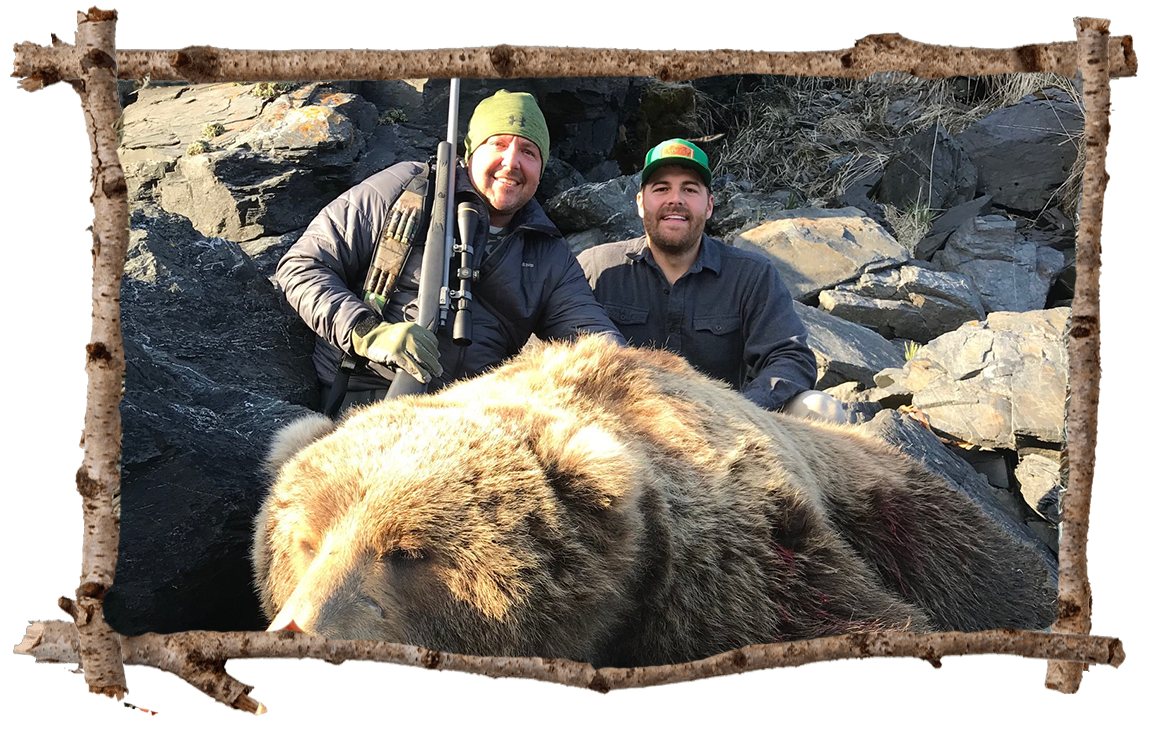 Two hunters with bear.
