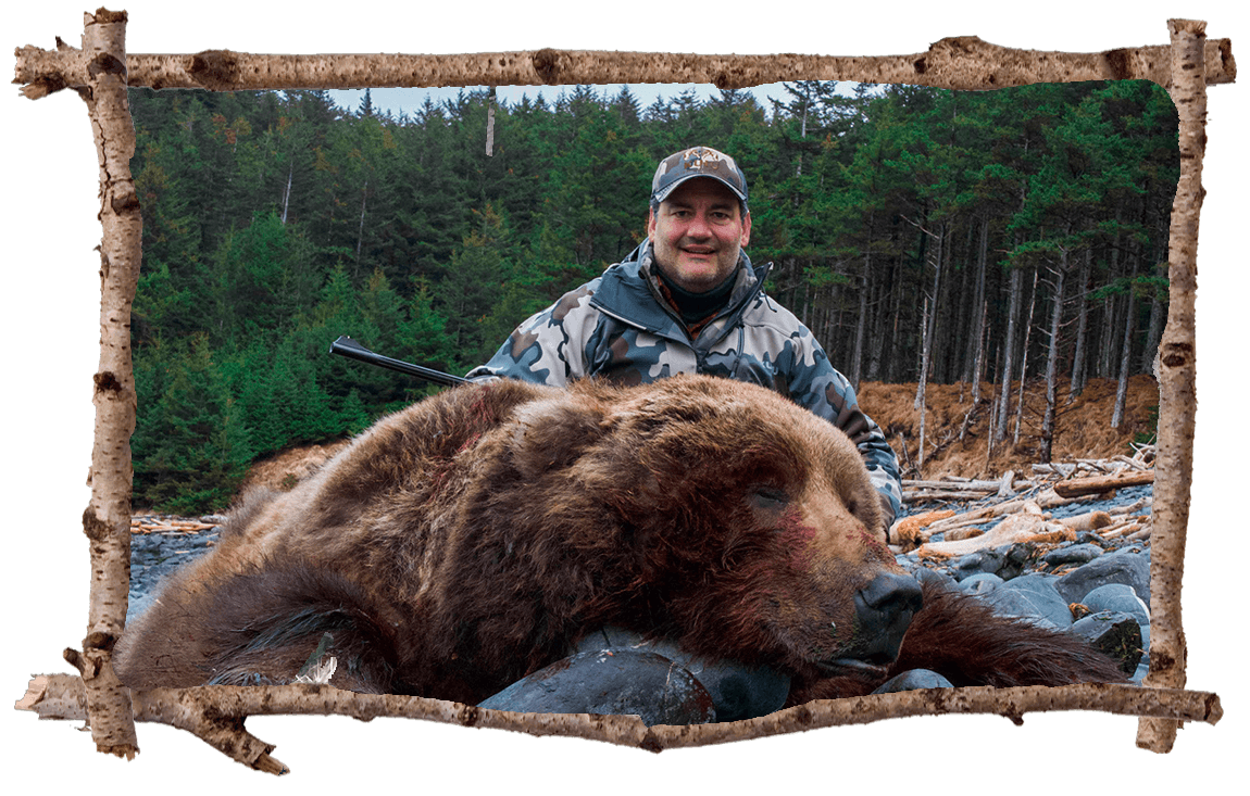 Joe DeMocko posing with bear.